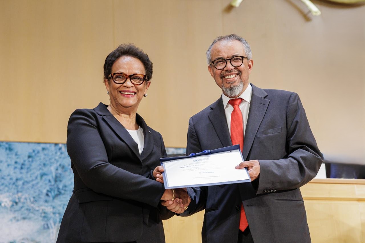 Her Excellency Patricia A. Hermanns received a certification of The Bahamas for the elimination of mother-to-child transmission of HIV from Dr. Tedros Ghebreyesus, Director General of the World Health Organization (WHO), during the 79th World Health Assembly in Geneva on 19 May 2026.